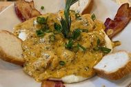Shrimp and grits from Surrey's Cafe & Juice Bar. (Image via Instagram/@surreysnola)